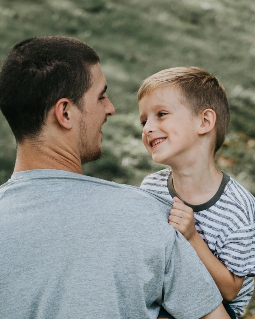 father holding his son