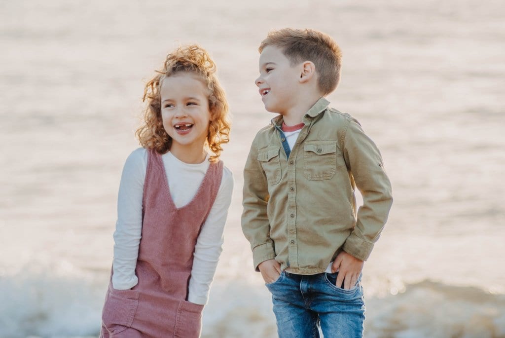 two children standing out side for a picture