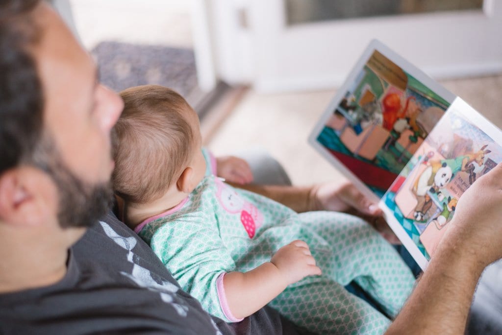 father reading to his child